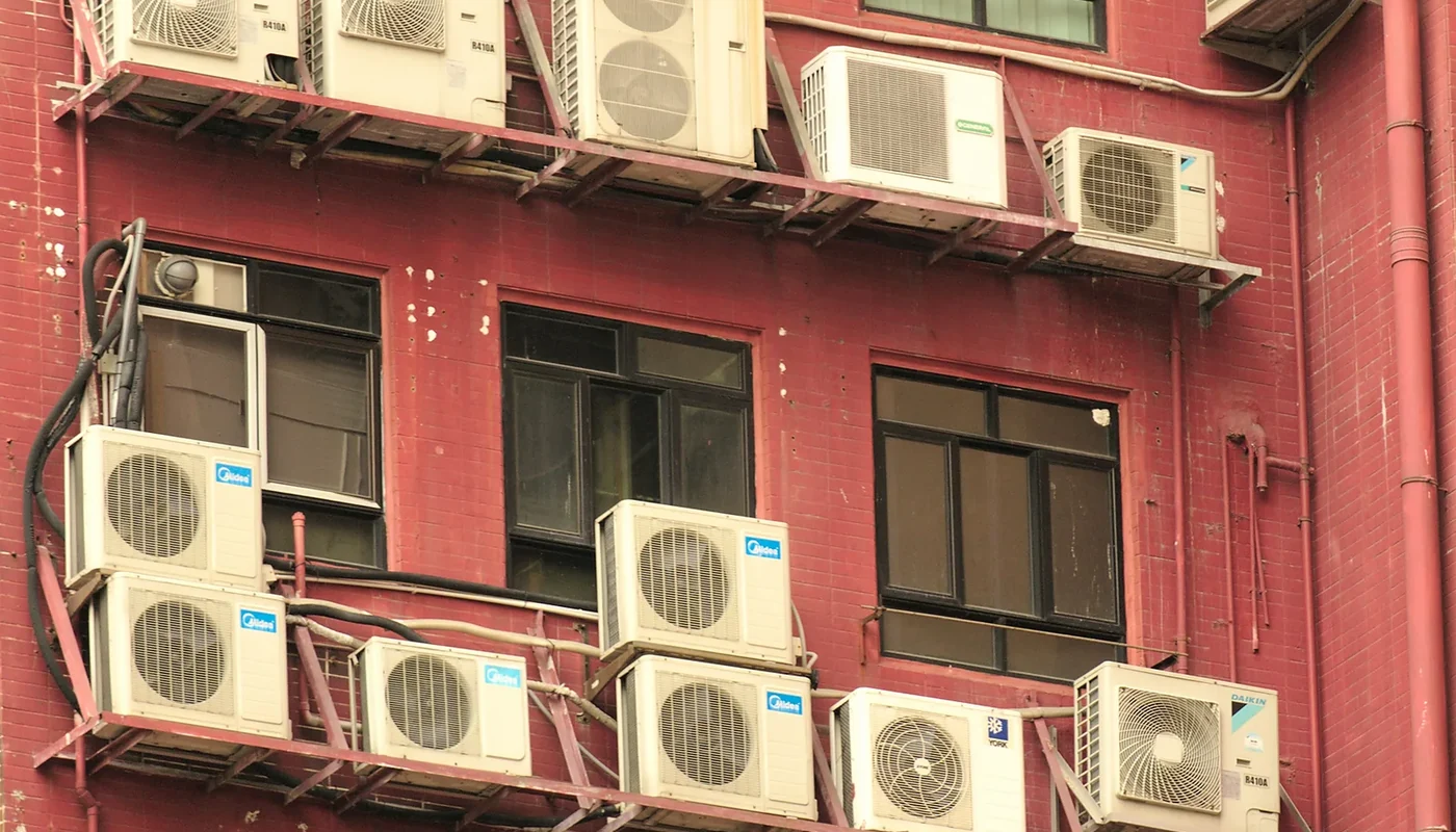 Rows of outdoor air-conditioning condenser units on a commercial building