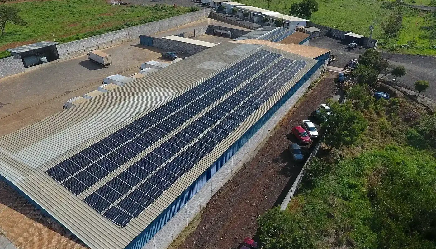Large rooftop solar array on an industrial building for a small-enterprise energy project