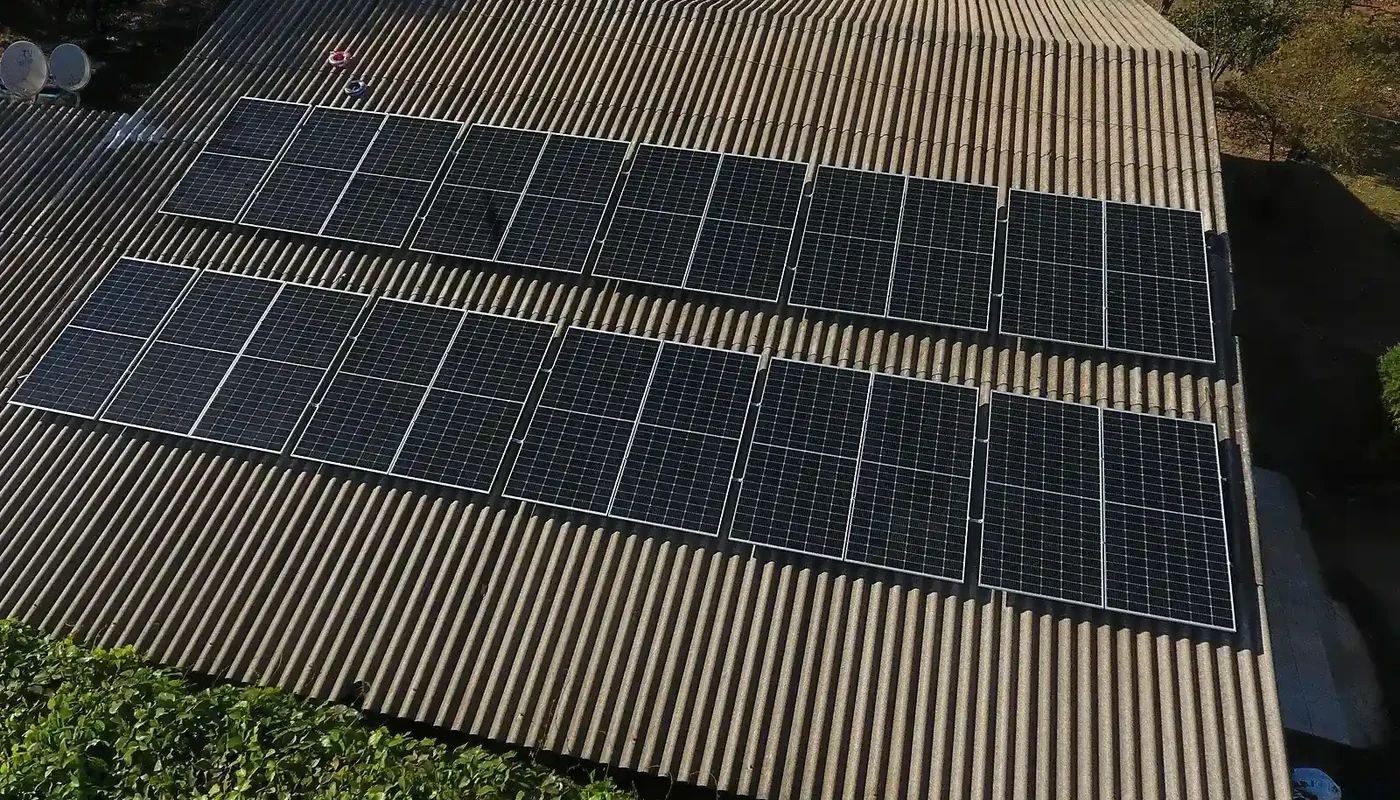 Aerial view of a corrugated rooftop solar array showing usable roof area