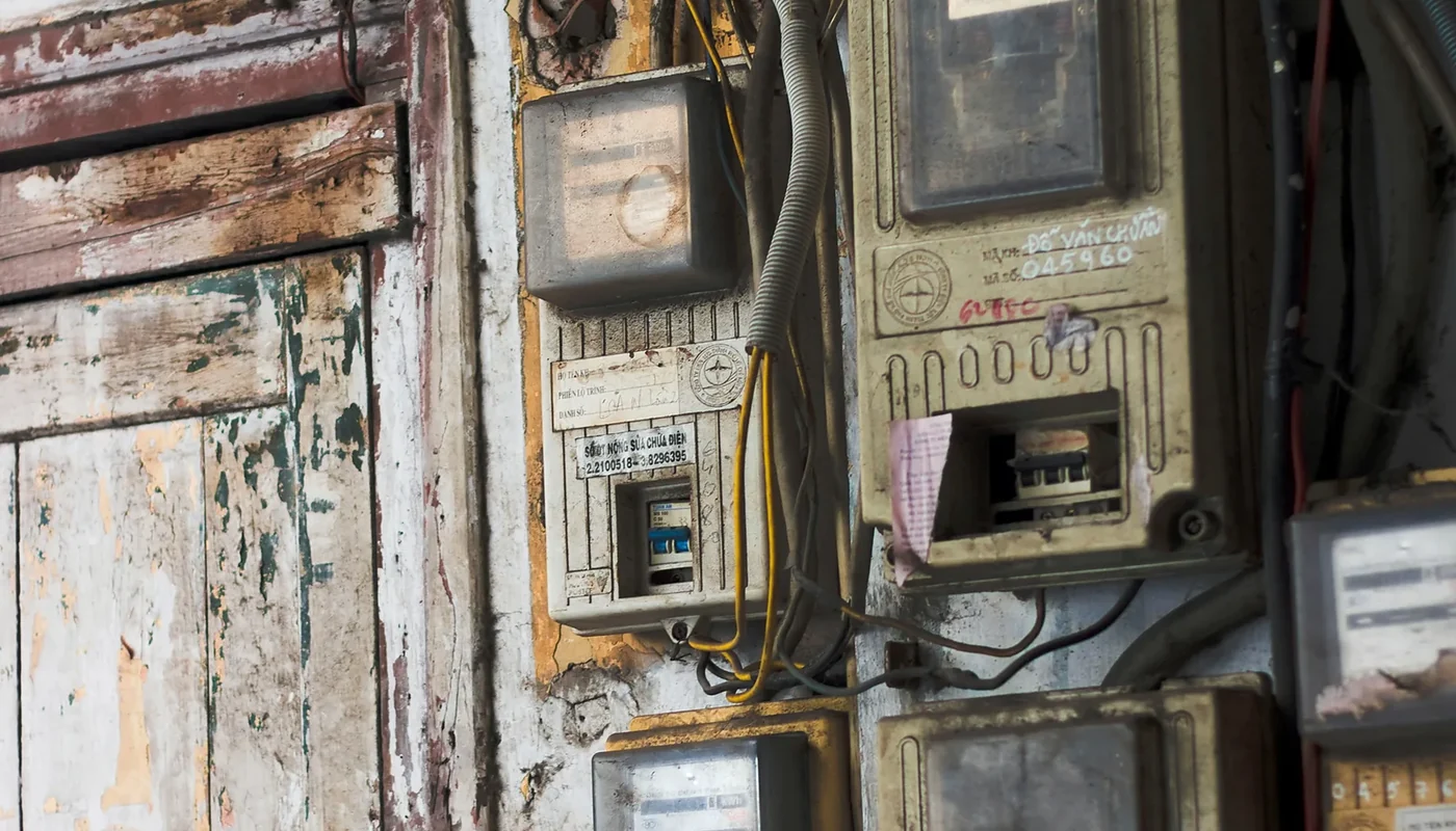 Older utility meters and service wiring representing the utility interconnection reviewed for net metering